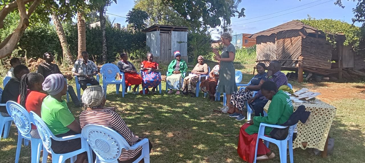 An outdoor community training session with women farmers